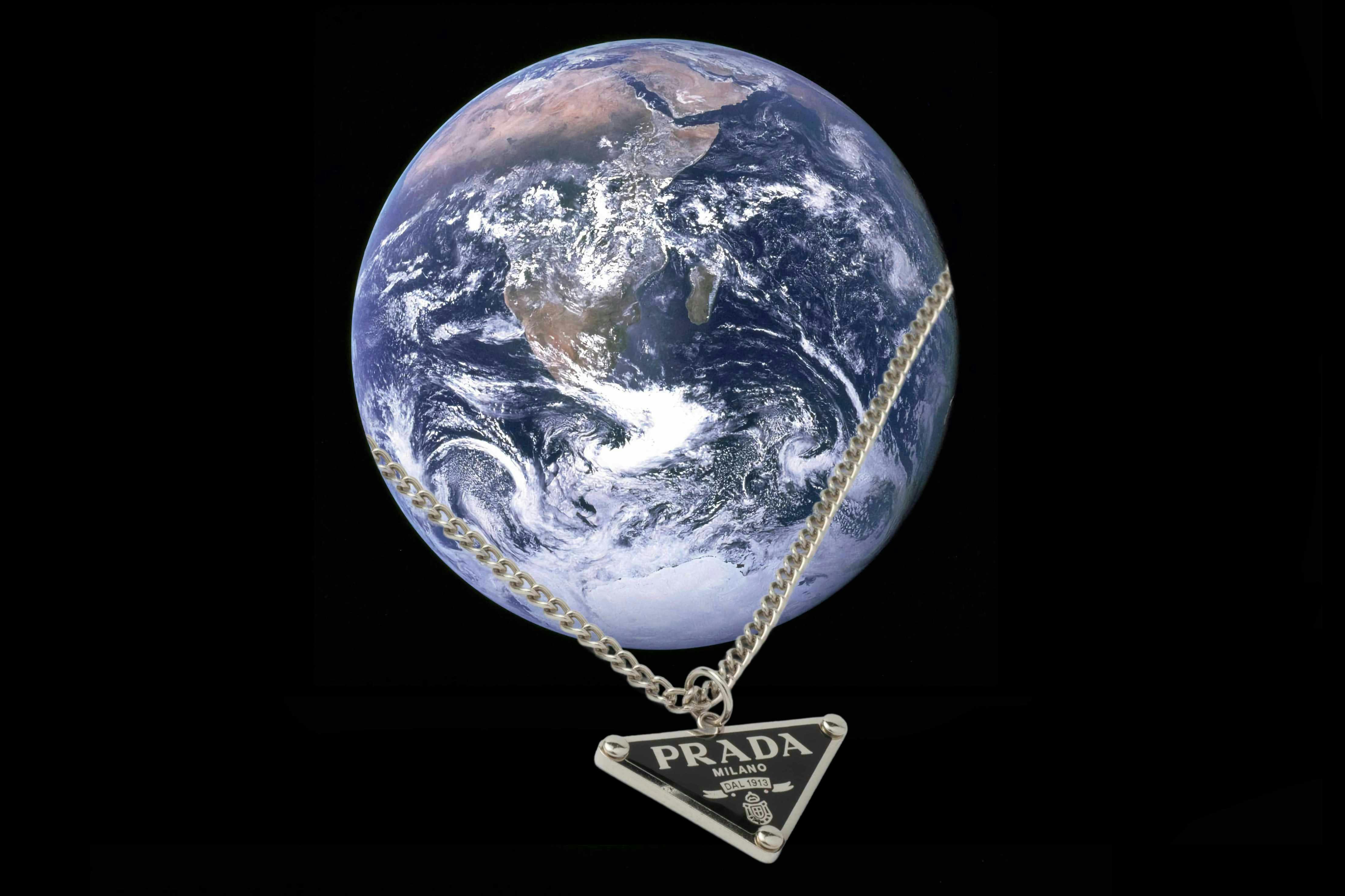 a prada necklace circles planet earth in outer space